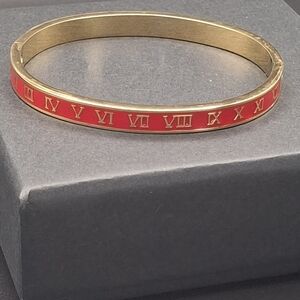 Gold-Tone Bracelet with Red Roman Numeral Inlay